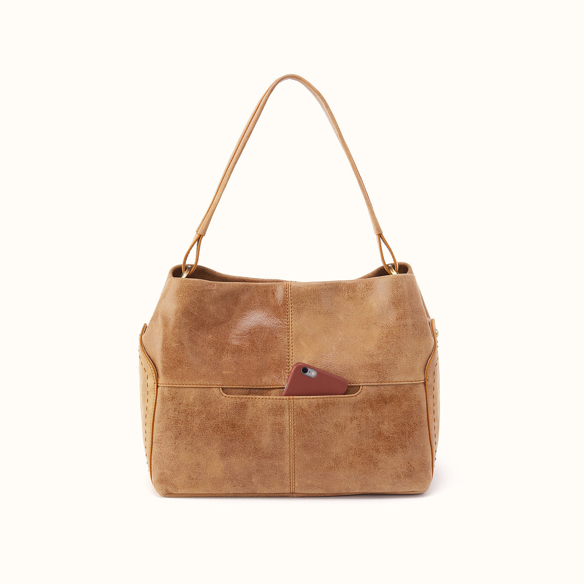 A tan faux-leather shoulder bag with a single strap and a front pocket holding a brown phone, shown against a plain white background.