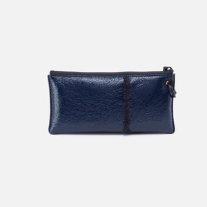 Vida Wristlet in Pebbled Patent With Faux Shearling - Deep Indigo