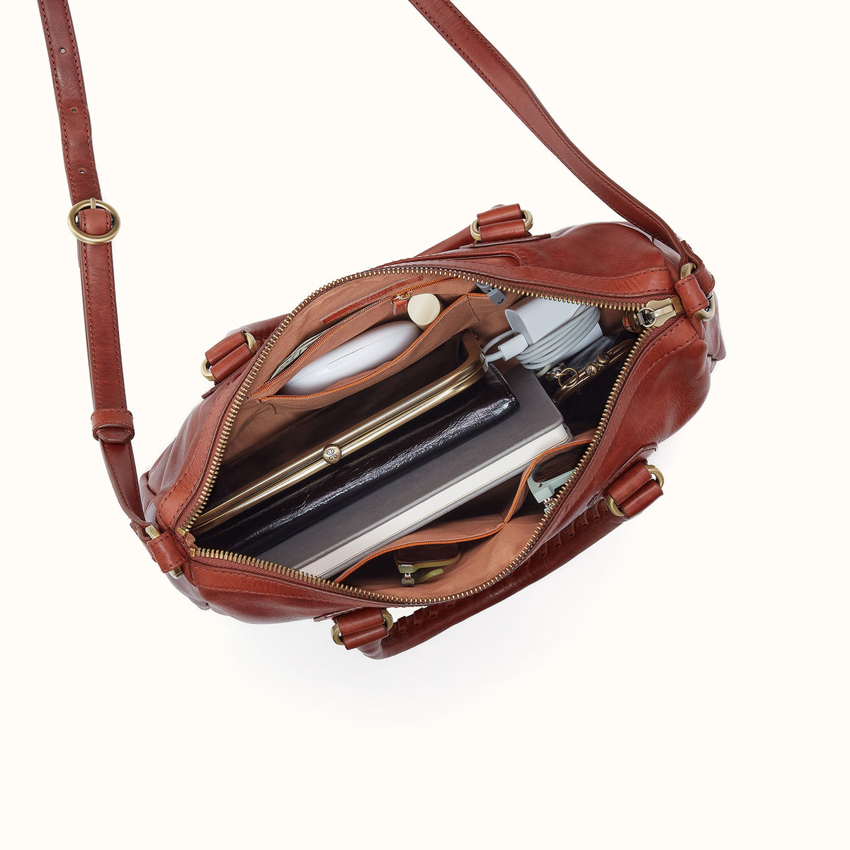 Brown leather handbag with gold accents on a white background
