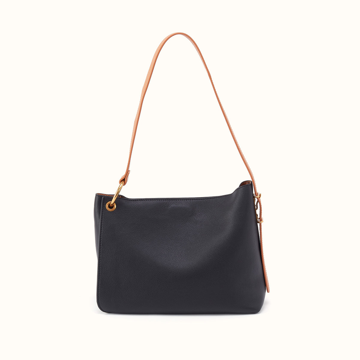 A black leather shoulder bag with a thin tan leather strap and gold-tone hardware, shown against a plain off-white background.