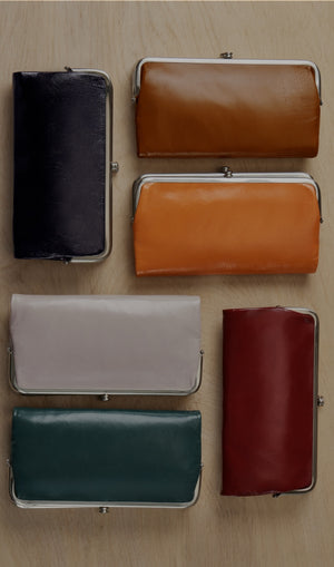 From the iconic clutch-wallet to a new crossbody and wristlet. Find the style for you.